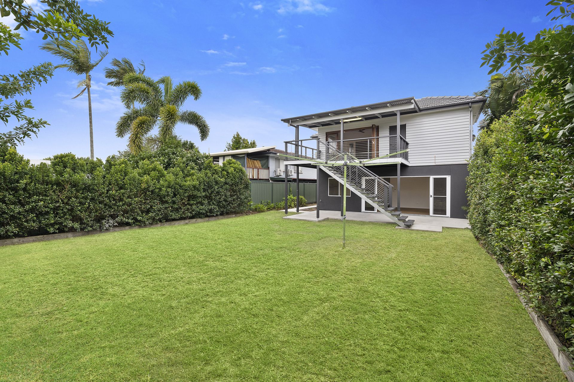 Backyard and the raised home